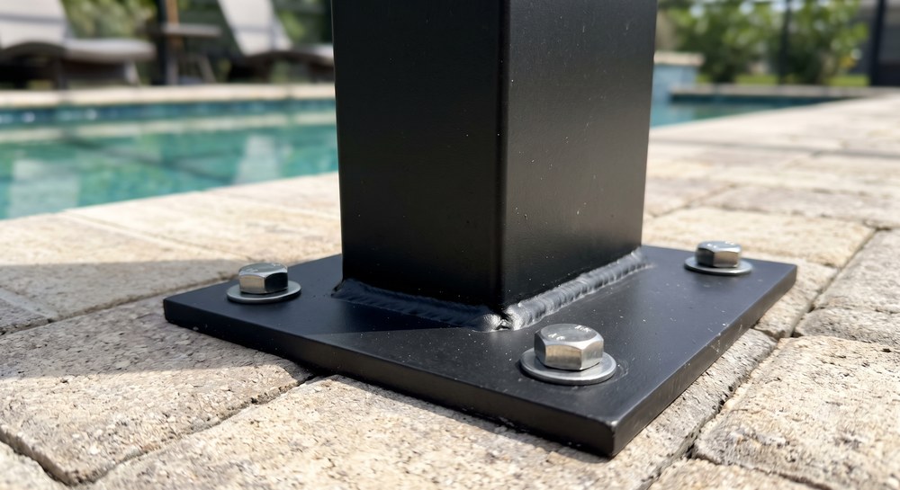 Heavy aluminum pool cage frame and anchors built to Florida wind-load code in Sarasota, FL